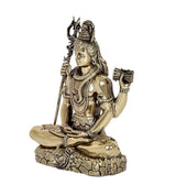 Side view brass Lord Shiva idol seated, trident and hand ornaments visible