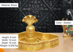 Brass Shiva Ling murti, golden color; height 8 inch ornate tray base