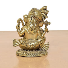 Brass Lord Ganesha idol, rear/side view with flowing hair and embellished back