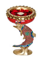 Ethnic brass urli pot candle holder with fish-themed base and red bowl
