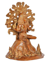 Brass Dakshinamurti Shiva statue, three-quarter view with carved halo and calm face