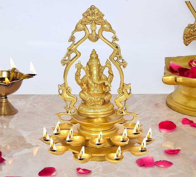 Brass Ganesha diya lamp idol with 20 diya holders, lit flames, front