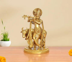 Brass Krishna playing flute with cow idol, 9-inch height, golden finish