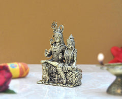 Brass Shiva and Parvati seated together on base, detailed crowns and jewelry