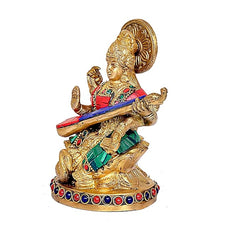 Maa Saraswati statue from side view, raised halo, blue veena and colorful gems