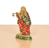 Radha-Krishna brass idol side view, red and green garments with floral patterns and beadwork