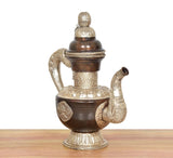 Brass tea kettle decor with curved handle, silver spout ends, and decorative base