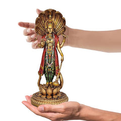 Resin Vishnu statue on lotus base, shown held by hands, front figure with painted robes