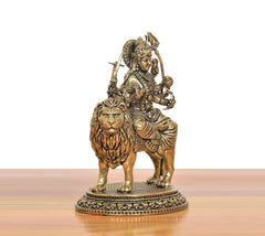 Brass Durga Maa figurine on lion, three-quarter view with lion head and ornaments