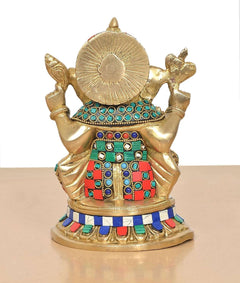 Rear view of brass Ganesha idol with fan-like halo and jeweled back panel