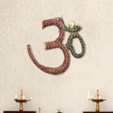 Brass OM wall hanging sculpture with red and teal jeweled inlay, arched shape