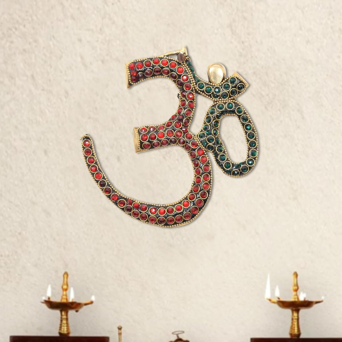 Brass OM wall hanging sculpture with red and teal jeweled inlay, arched shape