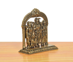 Brass Ram Darbar statue from rear angle, ornate base and arched frame detail