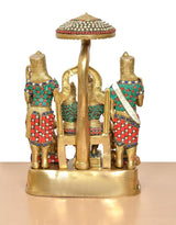 Brass Ram Darbar statue rear view: umbrella canopy over attendants and central pedestal