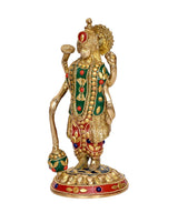 Brass Vishnu four-armed standing idol, side angle, jeweled colors on chest and garments
