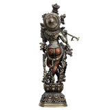 Brass Krishna idol statue from behind, circular halo backplate and ornate base