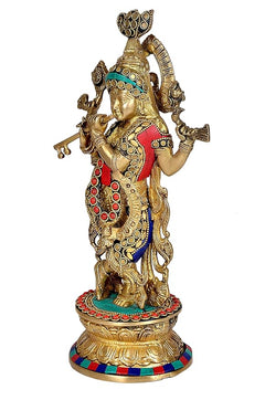 Brass Krishna playing flute figurine, side view, red robe with blue details, ornate ornaments