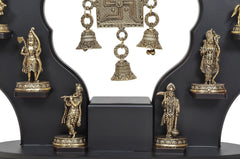 Central swastik panel with brass bell ornaments on Dashavatara Vishnu wall hanging