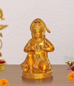 Brass Hanuman Ji sitting idol, gold finish, hands holding small central figure