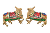 Brass cow pair wall hanging, two side-by-side figures with jeweled multicolor blankets