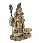 Brass Lord Shiva statue in profile, seated pose with trident and beaded chains