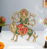 Brass Durga Maa idol on lion, green/red jeweled outfit, multiple raised weapons