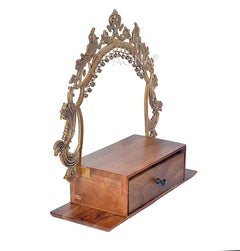 Brass frame wooden mandir with arched top and drawer, angled side view