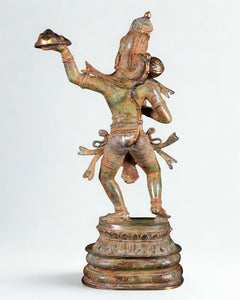 Bronze Hanuman sculpture back view, raised arms and decorative headdress, 18 in tall.