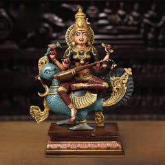 Brass Goddess Saraswati seated sculpture with veena on blue fish mount