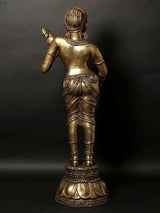 Back view of brass standing Apsara sculpture with patterned hair and ornamented base