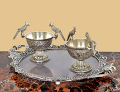 Parrot dry fruit bowl set with two silver bowls on ornate tray, empty