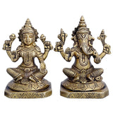 Brass deity idol statue: two seated figures with raised hands, detailed round base