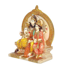 Resin Shiva Parvati family idol, side view with Ganesh figure and raised seated base