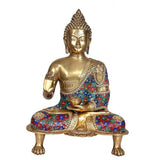 Brass Buddha idol seated, abhaya mudra gesture, gold face, multicolor robe