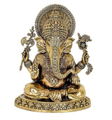 Ganesha brass statue front view, jeweled crown, long trunk, raised arms, ornate base