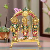 Brass Ram Darbar statue with three figures in colorful outfits on a pedestal