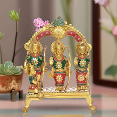 Brass Ram Darbar statue with three figures in colorful outfits on a pedestal