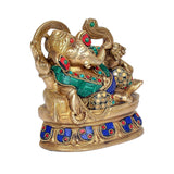 Brass Ganesha figurine, raised trunk holding ladoo; blue sari with green belt