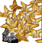 Close-up of gold metal butterflies over an abstract woman wall decor
