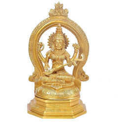 Brass Lakshmi statue seated with halo arch, raised hands, intricate crown and jewelry