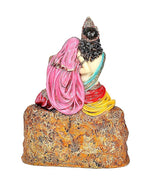 Resin Radha-Krishna idol, back view with flowing pink drape and dark hair on base