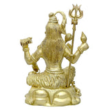 Brass Shiva idol statue side view, trident upright, seated with lions at base