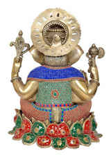 Rear view of Lord Ganesha brass sculpture with blue, red, and green patterned cloth