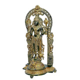 Brass Vishnu idol with arched prabhavali and detailed crown, standing on pedestal