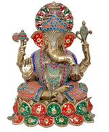 Lord Ganesha brass statue with multicolored crown, four arms, and decorative base