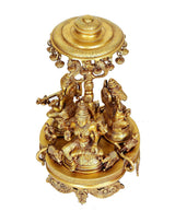 Brass deities on rotating chowki with detailed parasol canopy