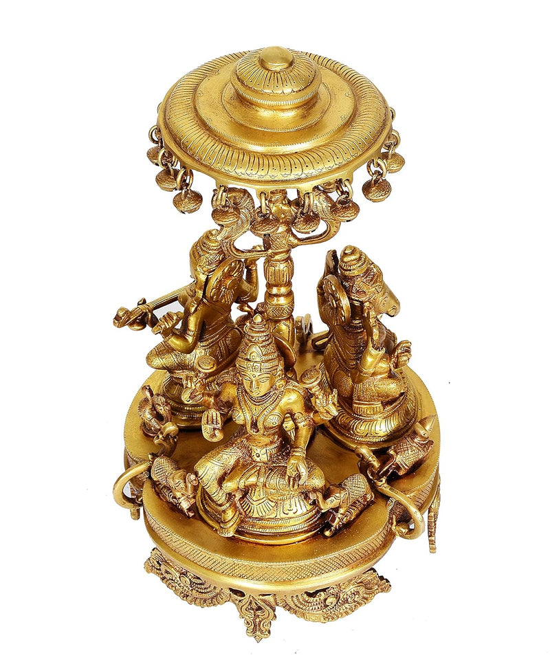 Brass Lakshmi, Ganesha and Saraswati Seated on Rotating Chowki with Parasol Idol (Height: 14 Inch)