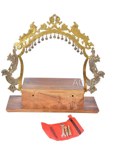 Brass arched mandir frame with hanging bells, wooden base with front drawer