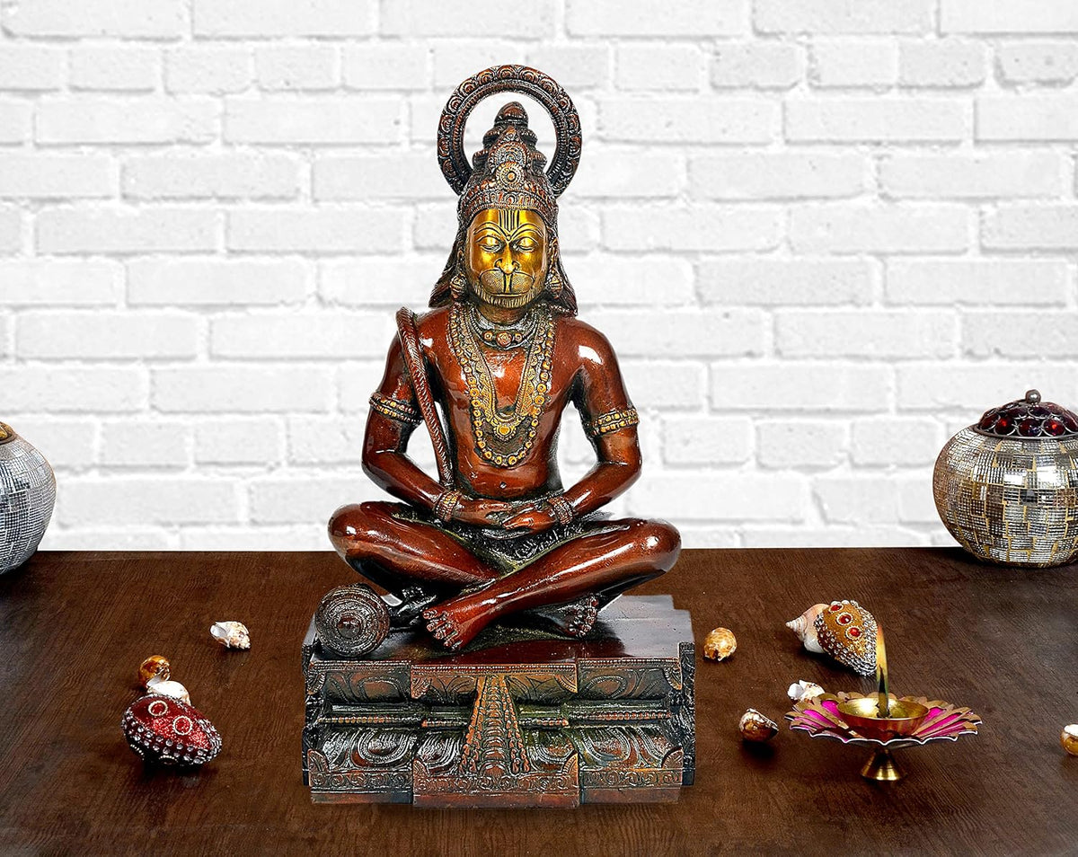 Bronze-toned Hanuman yoga pose idol statue, seated cross-legged on ornate base