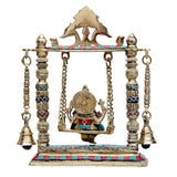 Brass Ganesha swing statue with back-turned figure, circular halo detail, hanging chains